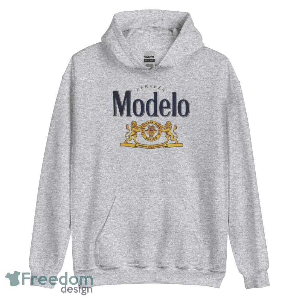 Modelo T Shirt logo the lion wins the trophy shirt image Modelo T Shirt logo the lion wins the trophy shirt - Unisex Heavy Blend Hooded Sweatshirt