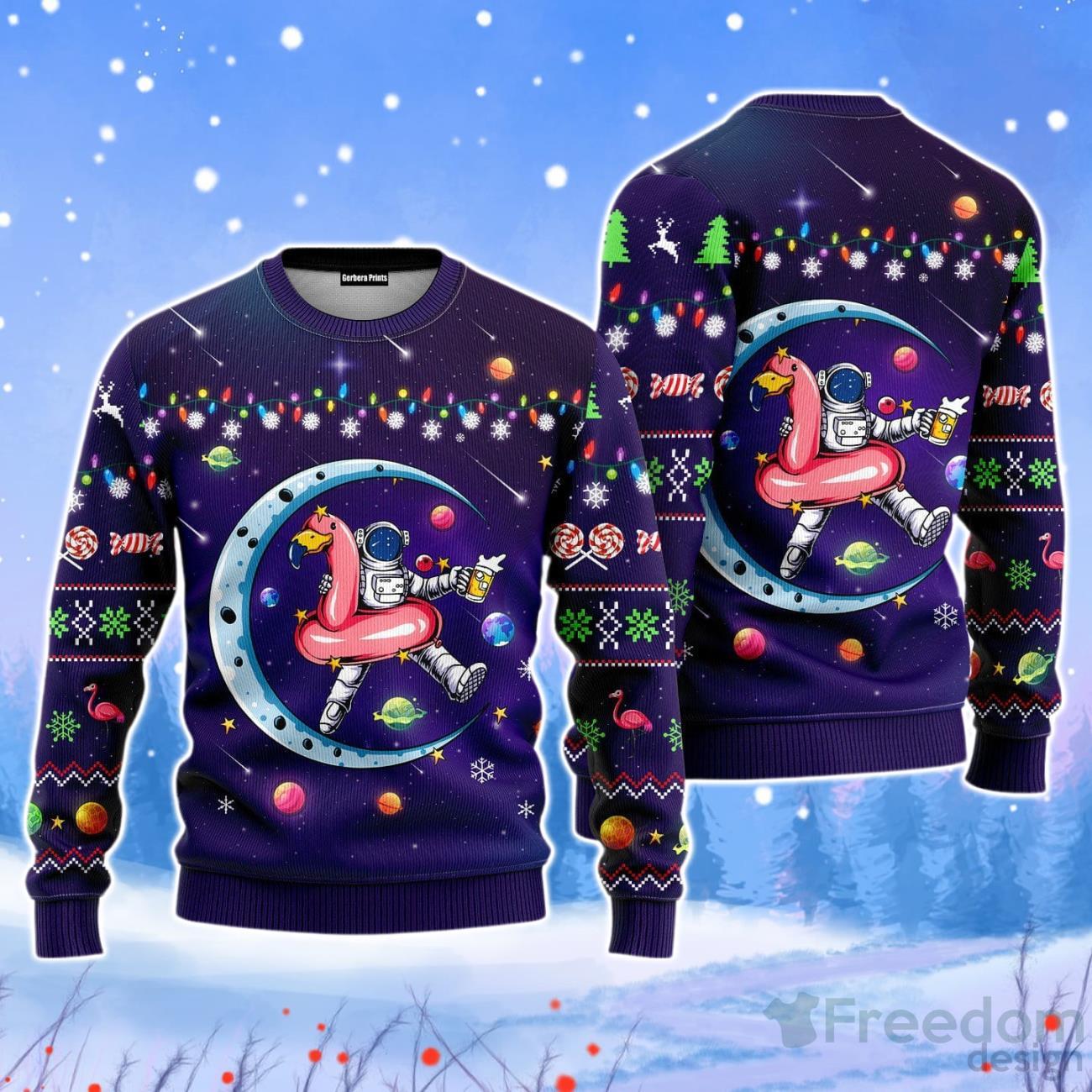 Funny Astronauts Sit On Flamingo Floats In Space With The Planet Christmas Unisex Ugly Sweater Product Photo 1