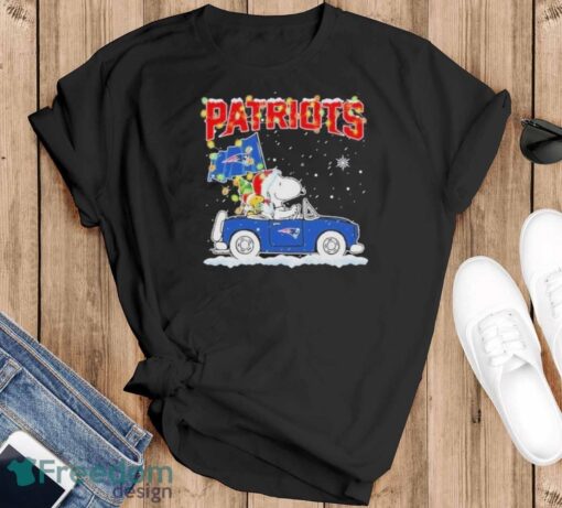 Design Snoopy And Woodstock santa car New England Patriots flag christmas shirt - Black T-Shirt