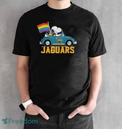 Official NFL Jacksonville Jaguars Snoopy and Woodstock driving car Pride Month 2024 t-shirt - Black Unisex T-Shirt