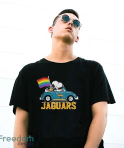 Official NFL Jacksonville Jaguars Snoopy and Woodstock driving car Pride Month 2024 t-shirt - G500 Gildan T-Shirt