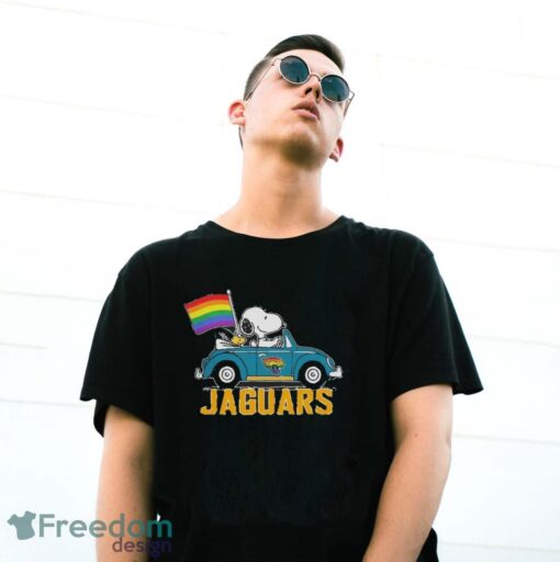 Official NFL Jacksonville Jaguars Snoopy and Woodstock driving car Pride Month 2024 t-shirt - G500 Gildan T-Shirt