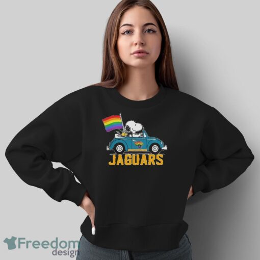 Official NFL Jacksonville Jaguars Snoopy and Woodstock driving car Pride Month 2024 t-shirt - Sweatshirt